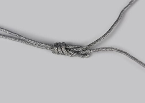 Grey cord with a loose knot in it